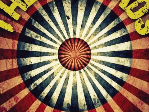 The Threads circular sunburst band logo in vintage carnival style with distressed yellow text